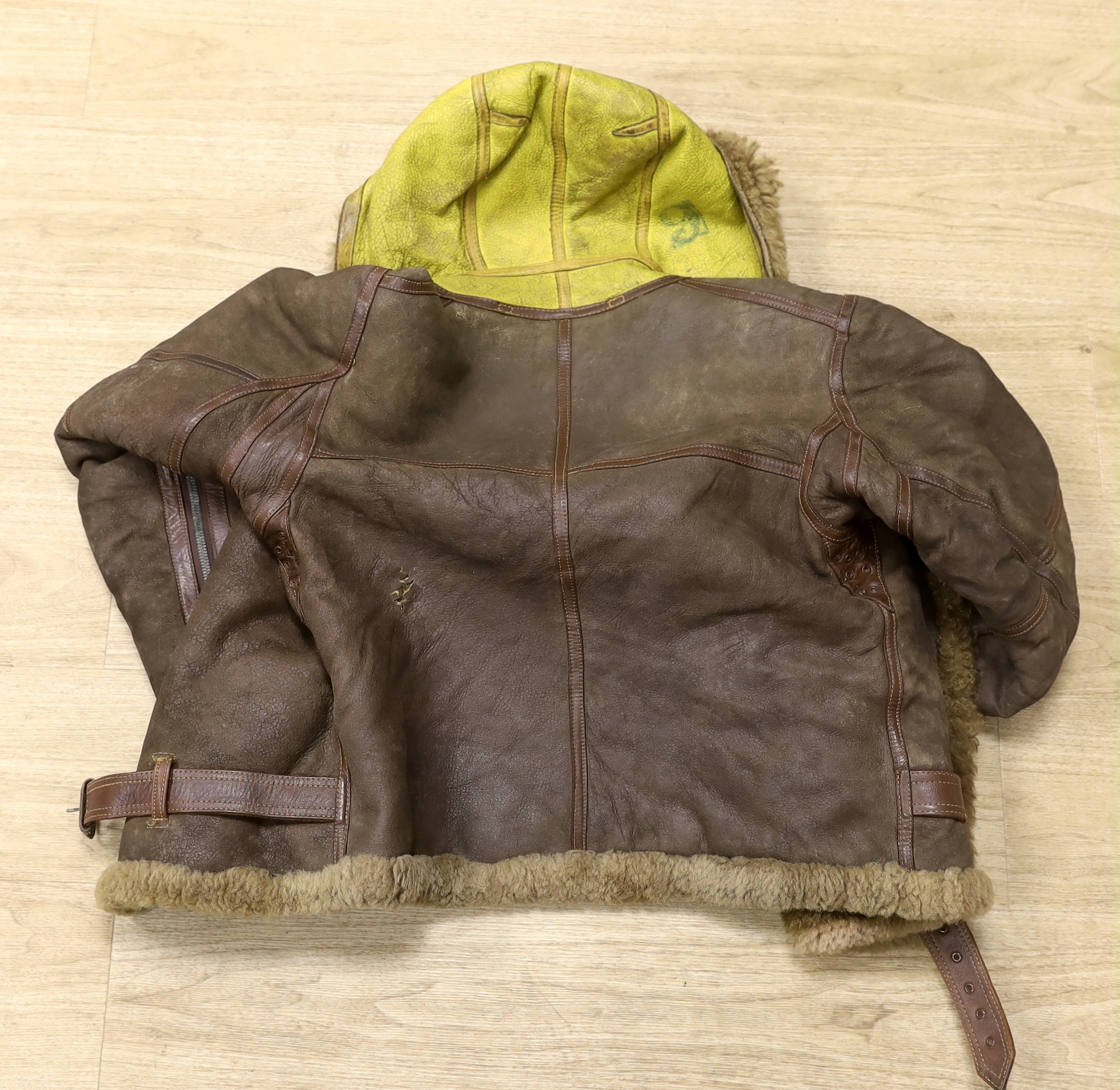 A WWII Air Ministry issue RAF sheepskin flying jacket, with original label stating; ‘AM Contract No.4636, Size: 2, Height: 5’5”-5’6”, Chest: 33-35, Waist: 30-32’, added in pen; H. Brown 130701, provenance - by family des